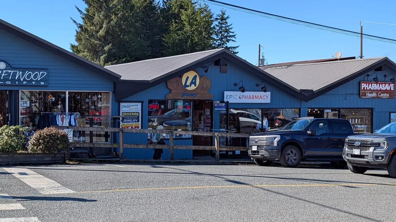 Local shops and a café in downtown Tofino under a blue sky