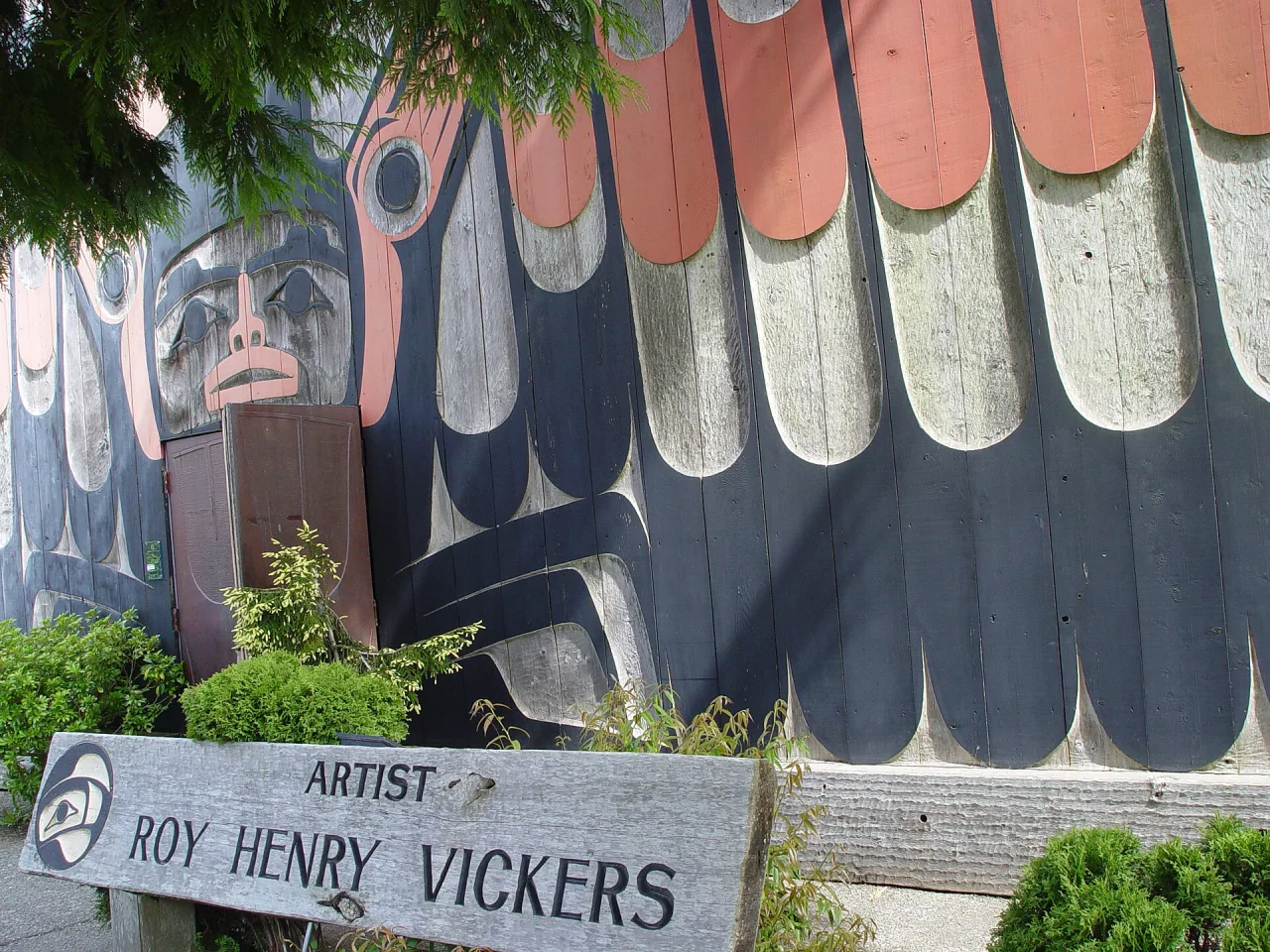 Carved and painted longhouse-style facade of the Roy Henry Vickers Gallery in Tofino